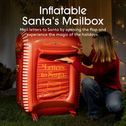 Inflatable Santa's mailbox with a person opening it, surrounded by festive lights.